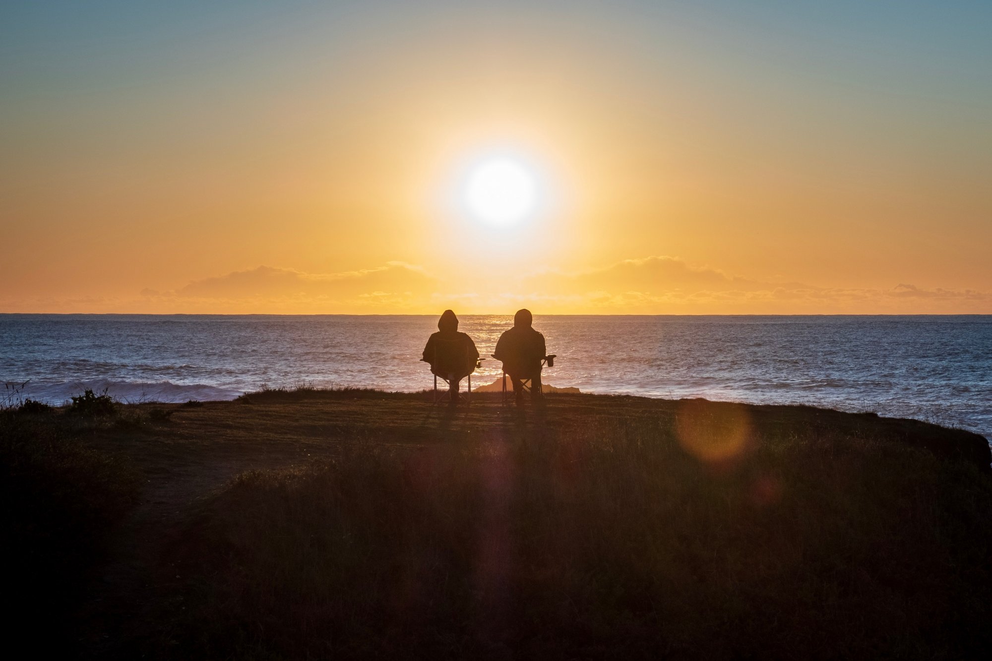 Marlston Forrest helped these two people to relax in retirement, beach at sunset.